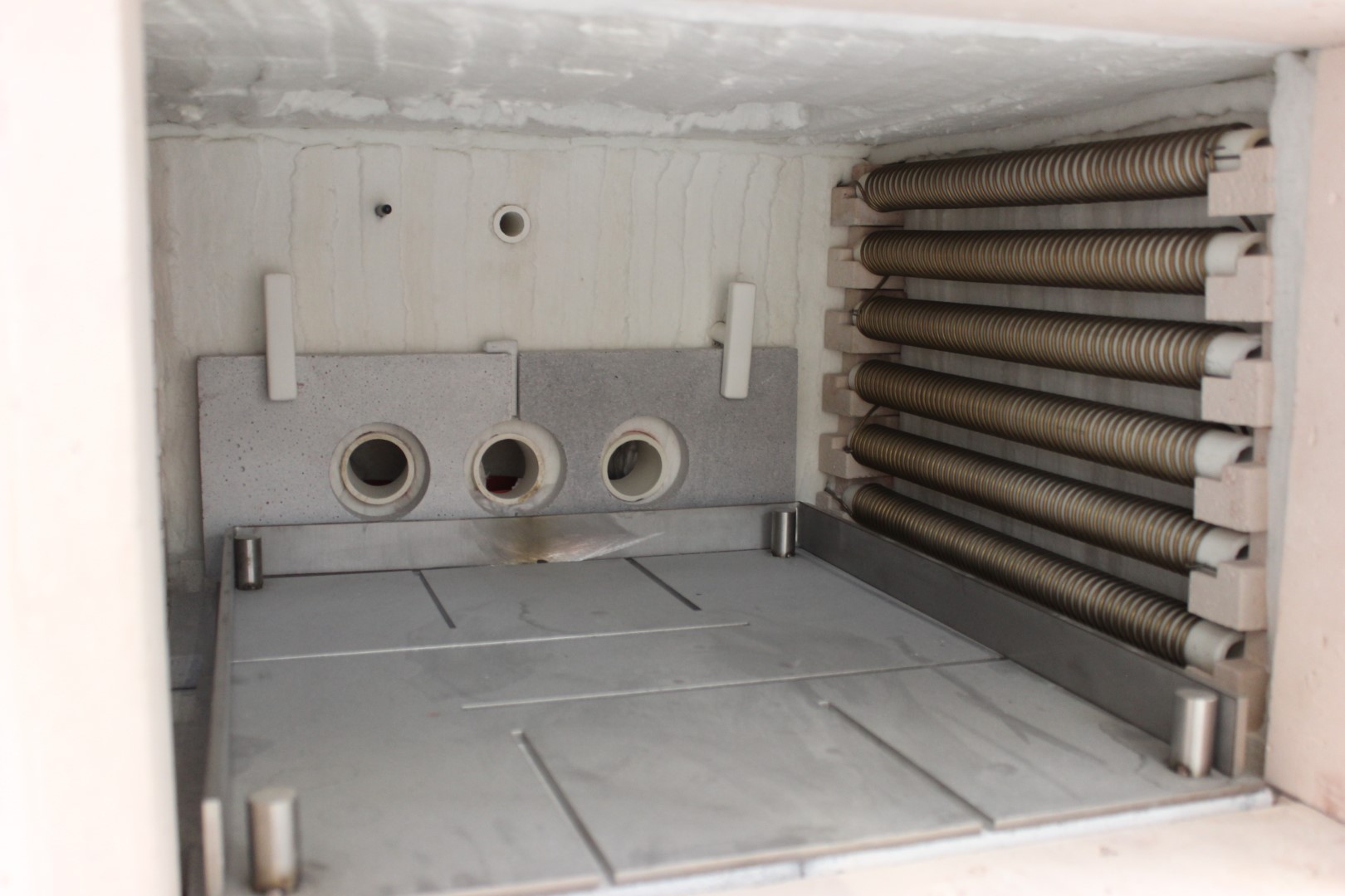 Industrial furnace chamber with heating elements installed along the walls for radiant heating